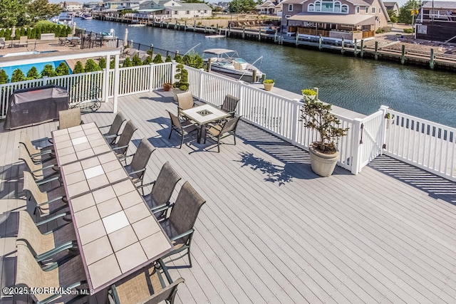 wooden deck with a water view