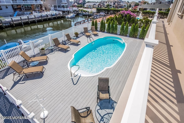 view of pool with a water view