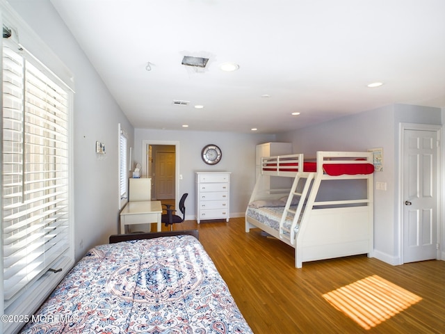 bedroom with hardwood / wood-style floors