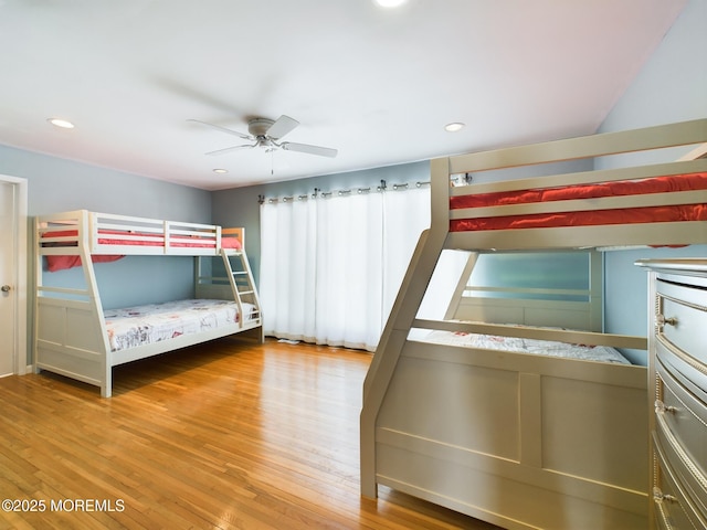 unfurnished bedroom featuring hardwood / wood-style flooring and ceiling fan