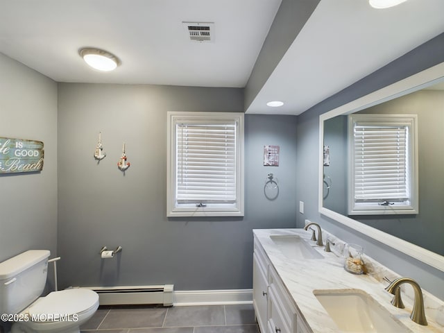 bathroom with vanity, a baseboard radiator, tile patterned floors, and toilet