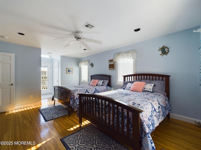 bedroom with wood-type flooring and ceiling fan