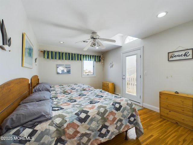 bedroom with access to exterior, light hardwood / wood-style floors, and ceiling fan