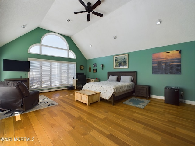 bedroom with ceiling fan, high vaulted ceiling, and hardwood / wood-style floors