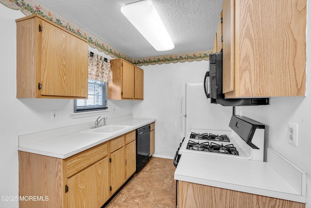 kitchen featuring sink, black appliances, and a textured ceiling