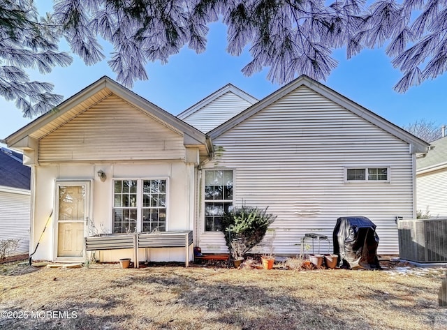 back of property with central AC