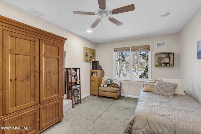 bedroom featuring light colored carpet and ceiling fan