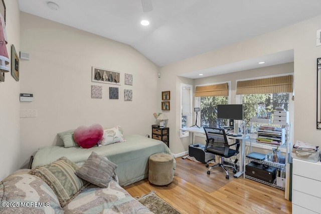 interior space with vaulted ceiling and light hardwood / wood-style flooring