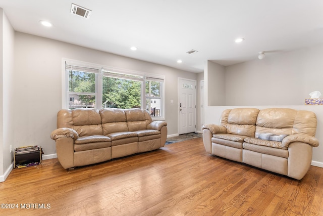 living room with light hardwood / wood-style flooring