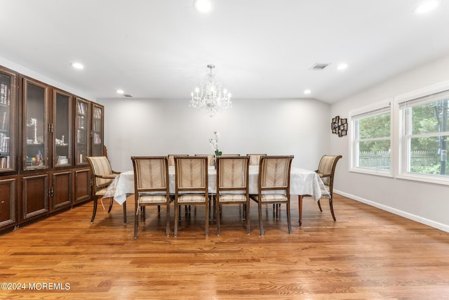 dining room featuring light hardwood / wood-style floors and an inviting chandelier