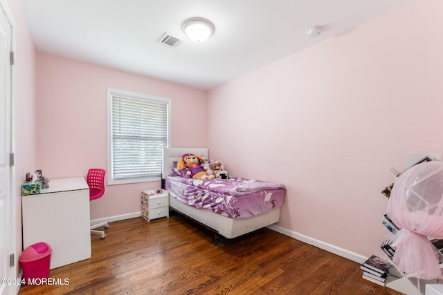 bedroom featuring dark wood-type flooring