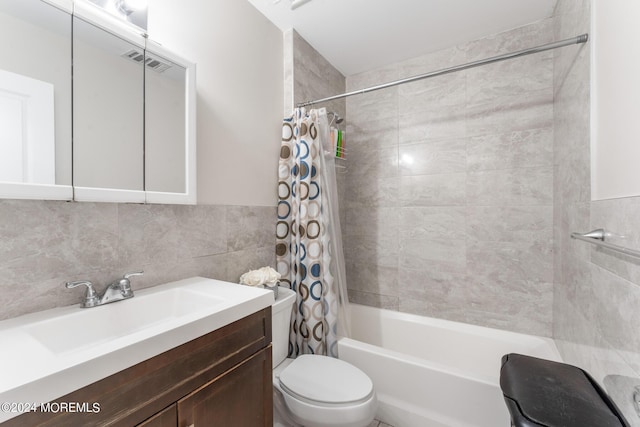 full bathroom with shower / bath combination with curtain, backsplash, vanity, tile walls, and toilet