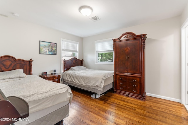 bedroom with hardwood / wood-style floors