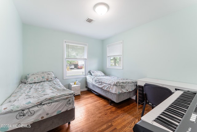 bedroom featuring dark hardwood / wood-style flooring