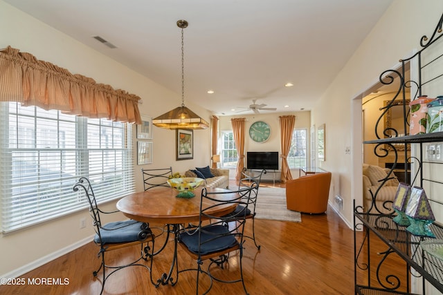 dining area featuring ceiling fan and hardwood / wood-style floors