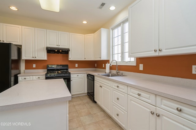 kitchen with sink, white cabinets, and black appliances