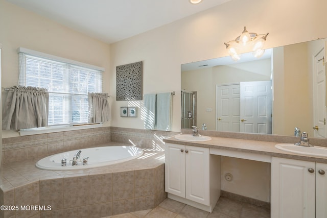 bathroom with plus walk in shower, tile patterned floors, and vanity