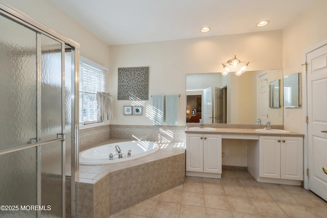 bathroom with tile patterned floors, separate shower and tub, and vanity