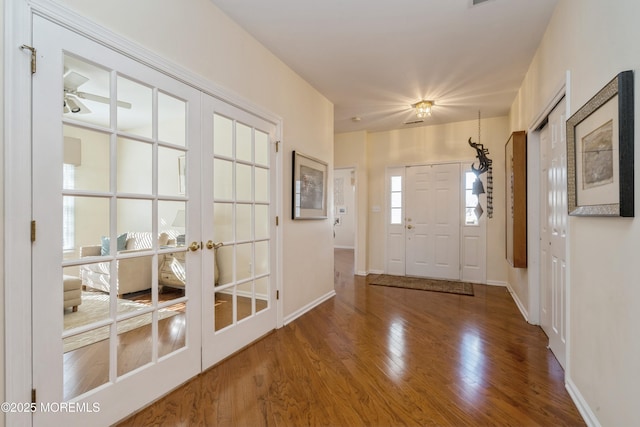 entryway with french doors and hardwood / wood-style floors