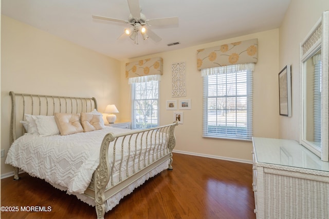 bedroom with ceiling fan and dark hardwood / wood-style flooring