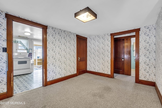 unfurnished room featuring light carpet