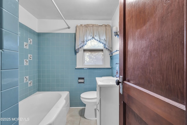 full bathroom featuring toilet, tile walls, tile patterned floors, shower / bathtub combination, and vanity