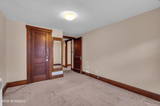 unfurnished bedroom with light carpet