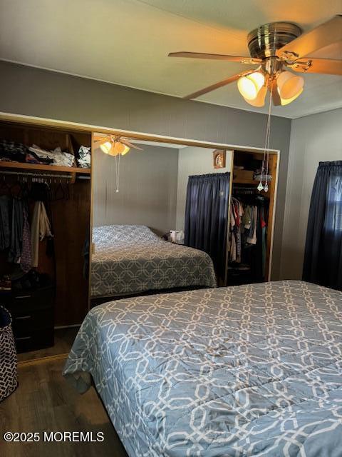 bedroom with ceiling fan and hardwood / wood-style floors