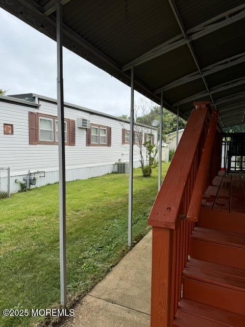 view of yard featuring central air condition unit