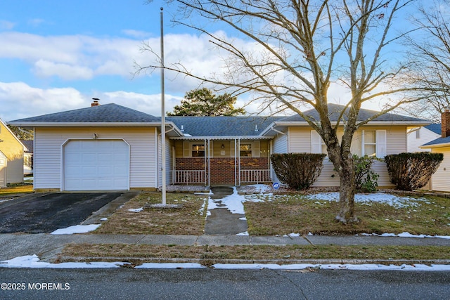 view of front of property featuring a porch and a garage