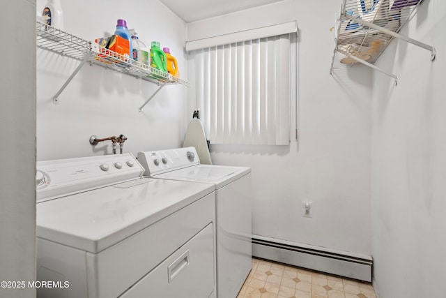 laundry room featuring baseboard heating and washing machine and dryer