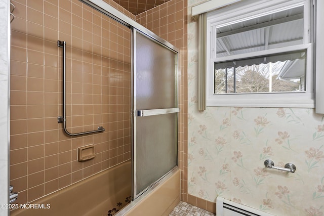 bathroom featuring a baseboard heating unit and enclosed tub / shower combo