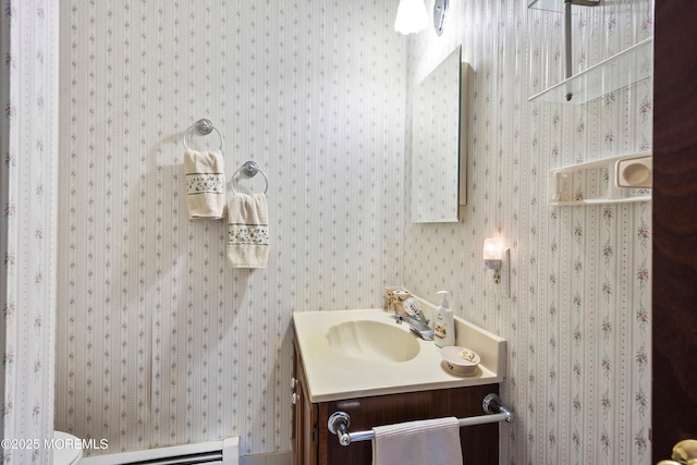 bathroom with vanity and a baseboard radiator