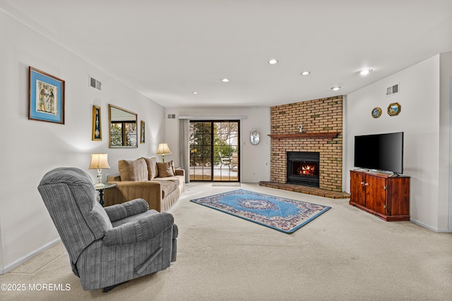 carpeted living room featuring a fireplace