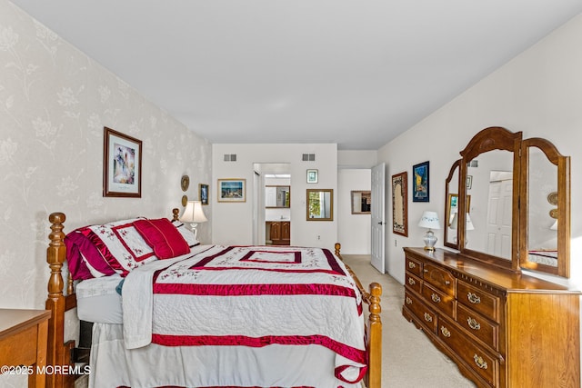 bedroom featuring light carpet