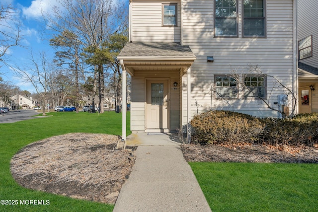 property entrance with a yard