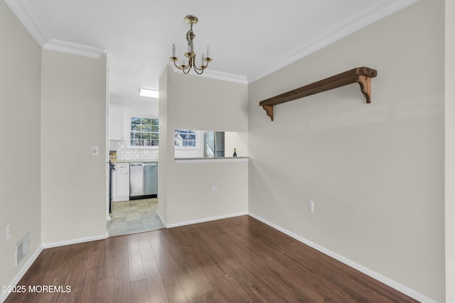 unfurnished living room with ornamental molding, a notable chandelier, and light hardwood / wood-style flooring