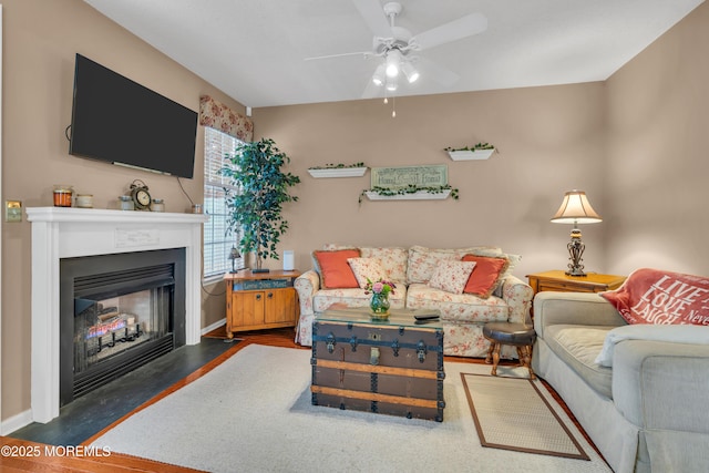 living room with ceiling fan and dark hardwood / wood-style flooring