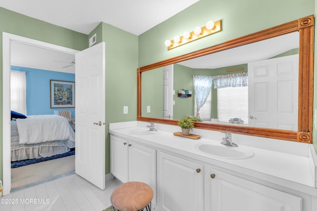 bathroom with ceiling fan and vanity