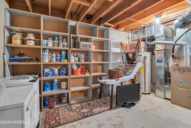 basement with water heater and washer and dryer