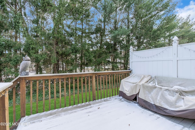 wooden deck with a lawn