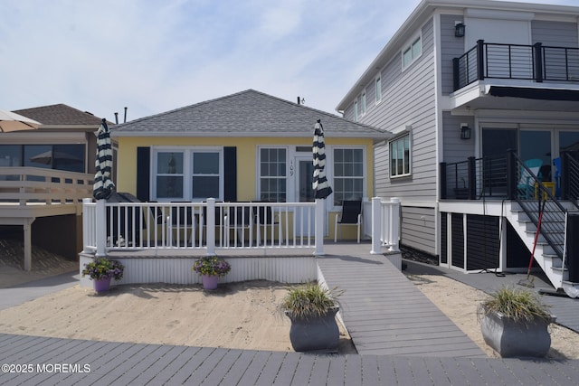 back of house with a balcony