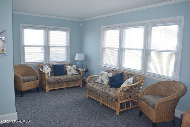 sitting room featuring ornamental molding, a wealth of natural light, and dark carpet