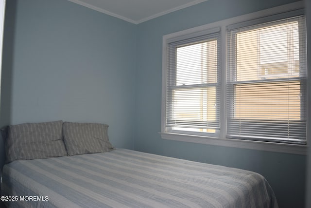 bedroom featuring crown molding