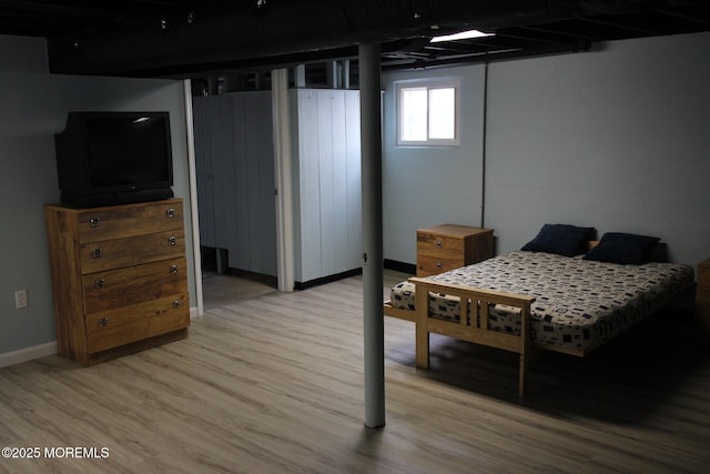 bedroom with light hardwood / wood-style floors