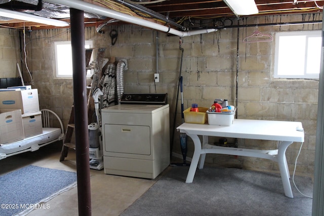 laundry area featuring a healthy amount of sunlight and washer / dryer