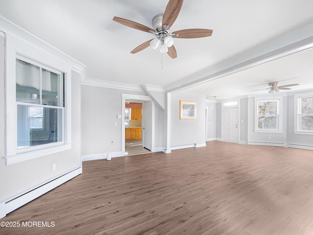 unfurnished living room featuring ceiling fan, crown molding, hardwood / wood-style flooring, and a baseboard heating unit