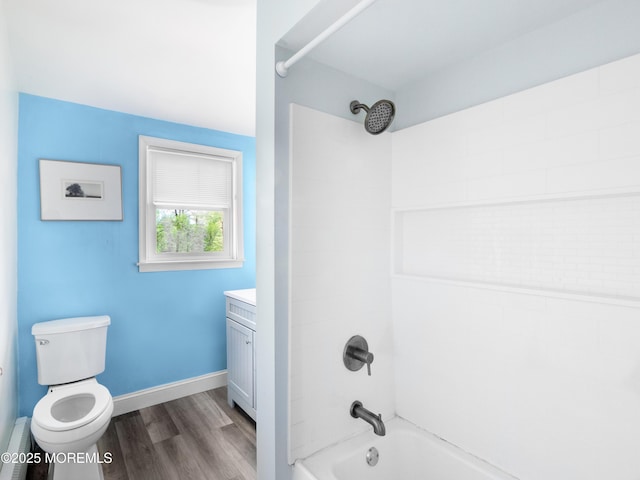 full bathroom featuring toilet, vanity, hardwood / wood-style flooring, and shower / bath combination