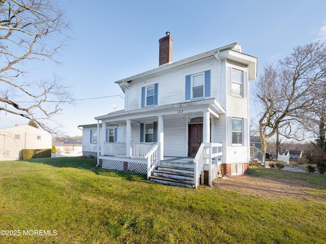 view of front of home featuring a porch and a front lawn