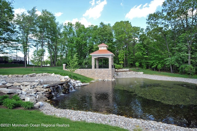 exterior space featuring a gazebo and a lawn